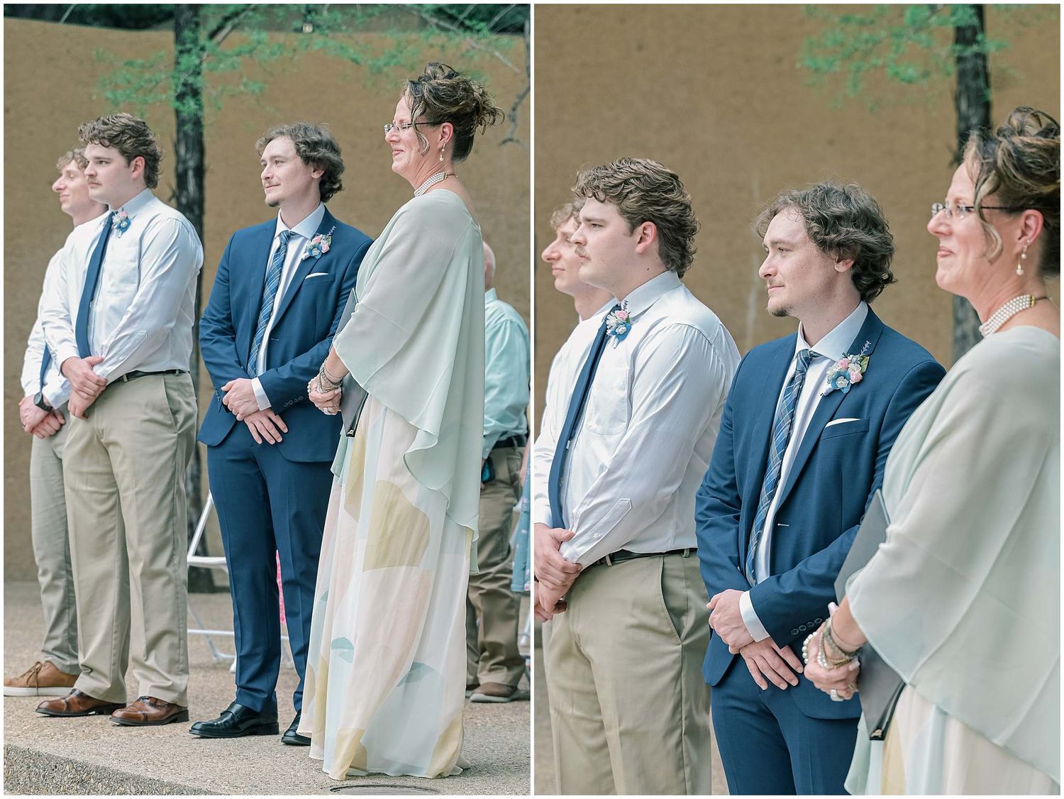 Wedding party members in suits and formal attire standing together in a line outdoors.