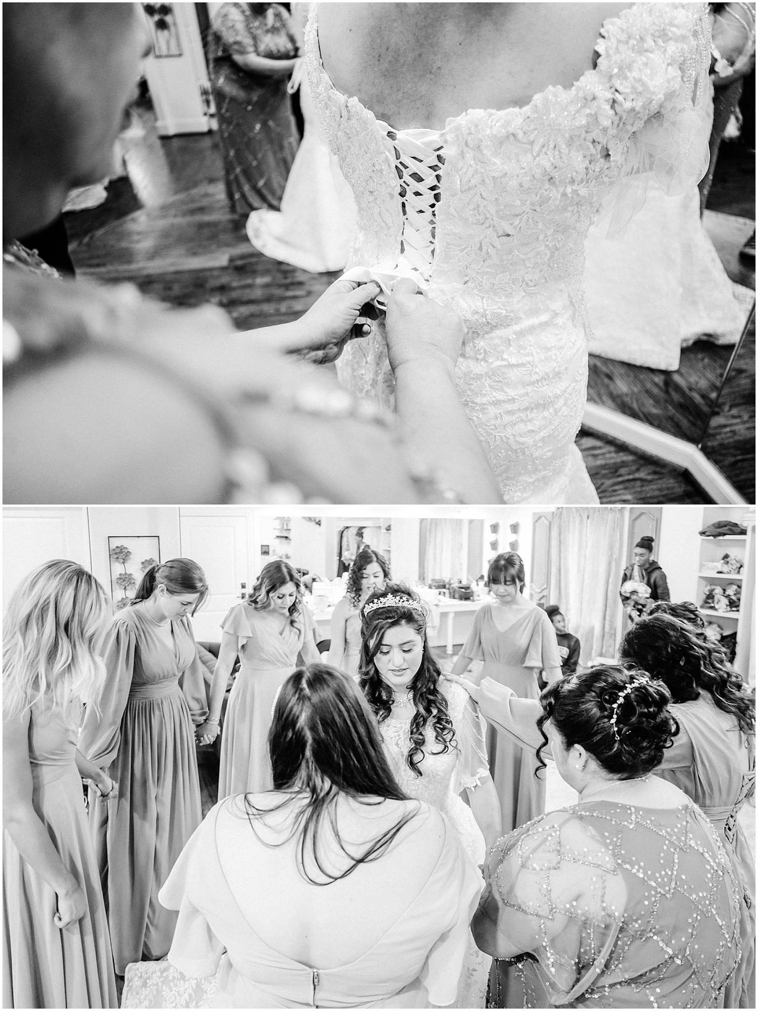 Bridesmaids helping bride into lace wedding dress while others gather around in elegant gowns during bridal preparations.