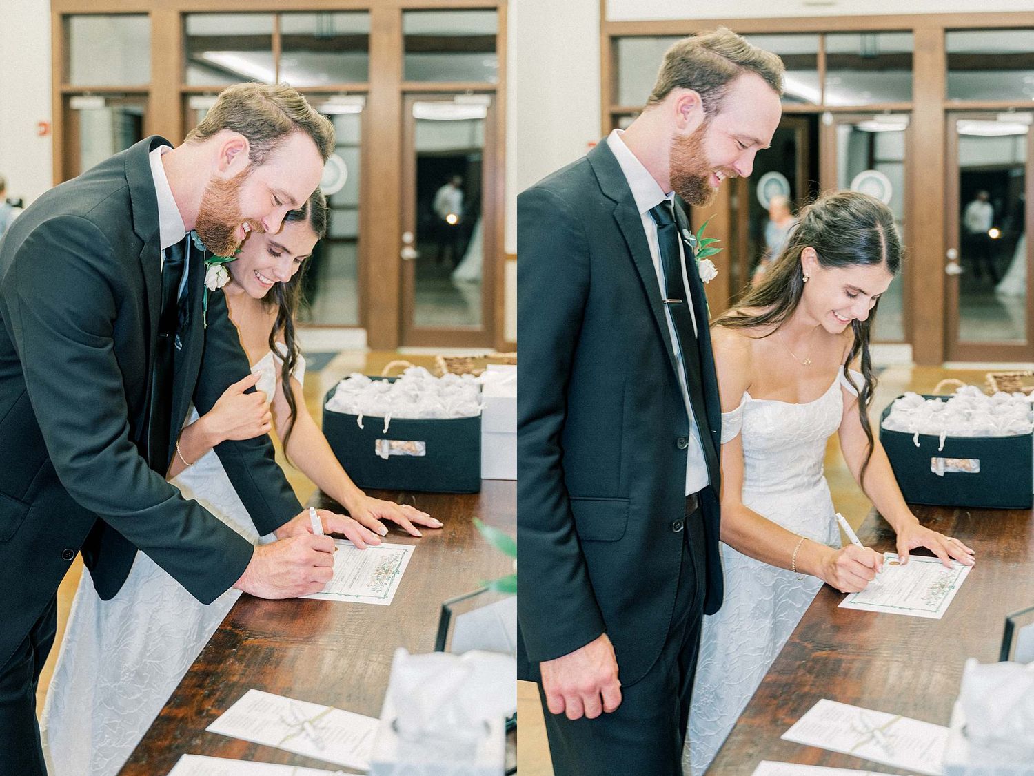 Wedding couple signing their marriage documents at a wooden desk during their ceremony.