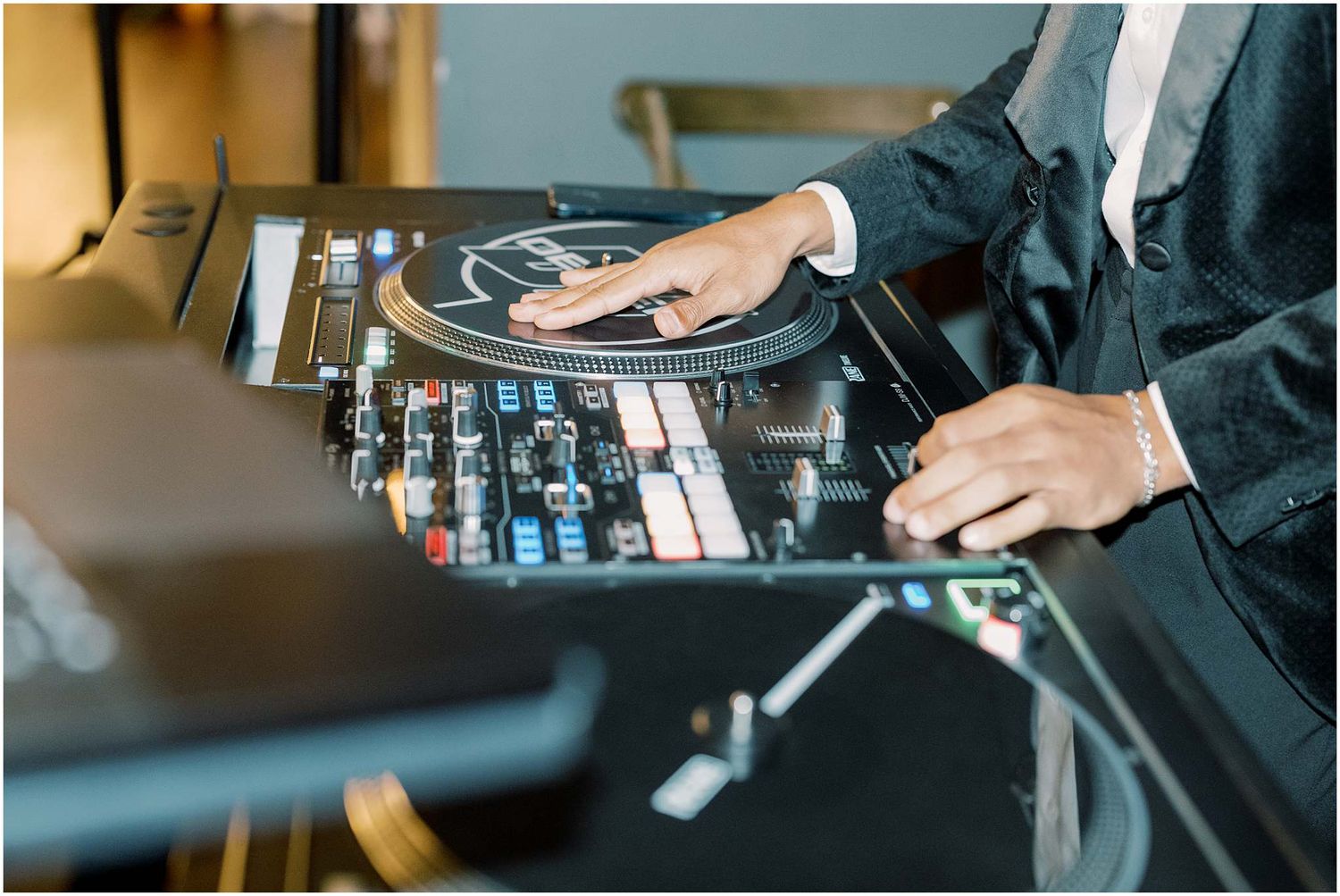 Close-up shots of DJ mixing equipment and controllers being operated during an event.