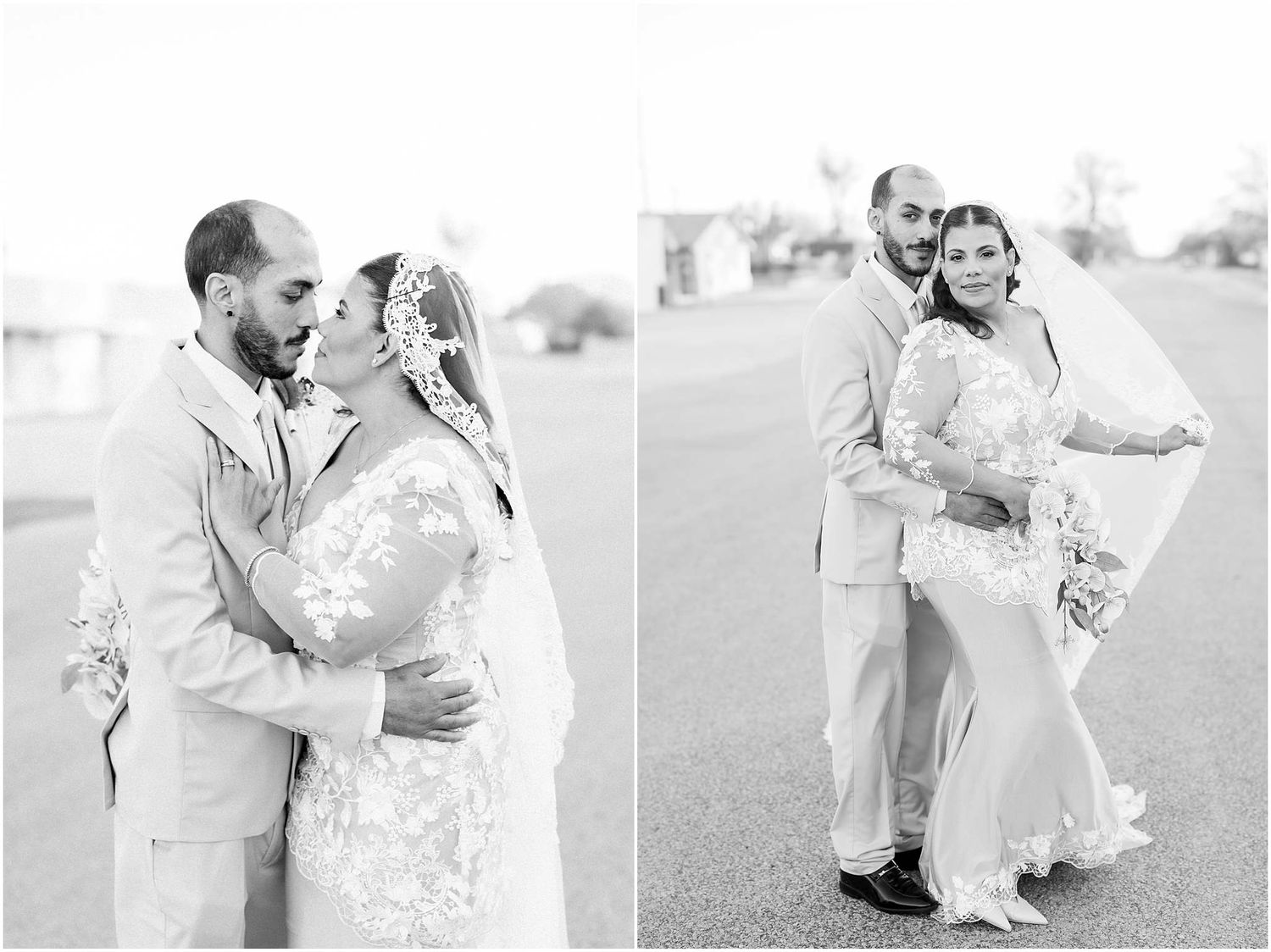 A romantic black and white wedding photo of a couple embracing on a paved road.