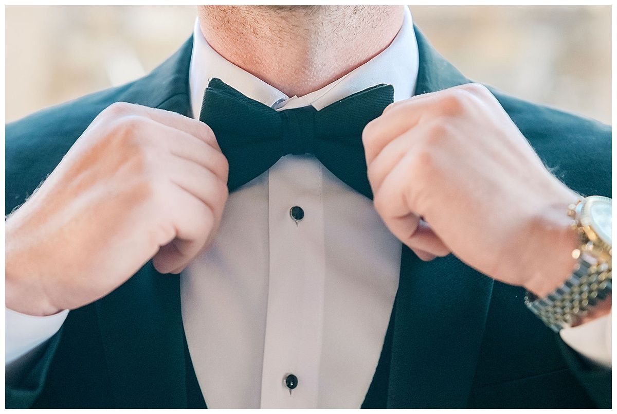 Close-up shots of formal black bow tie and tuxedo adjustments.