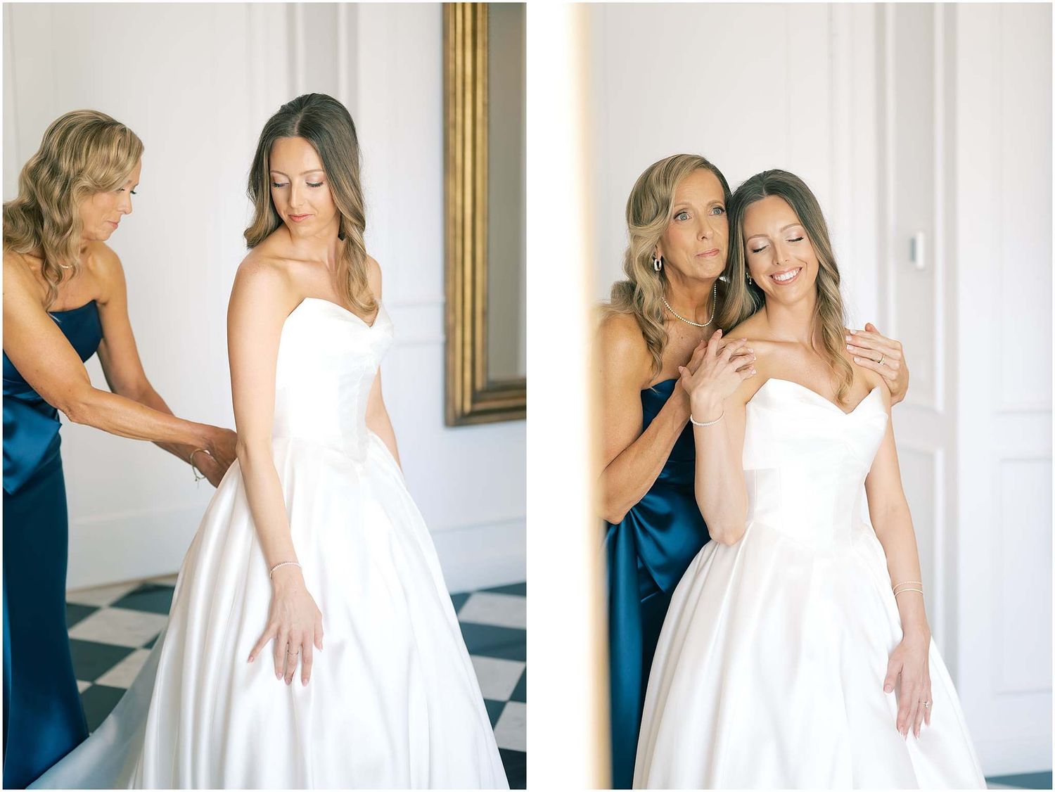 Bride in white gown being helped into dress by bridesmaid in navy blue at elegant wedding venue.