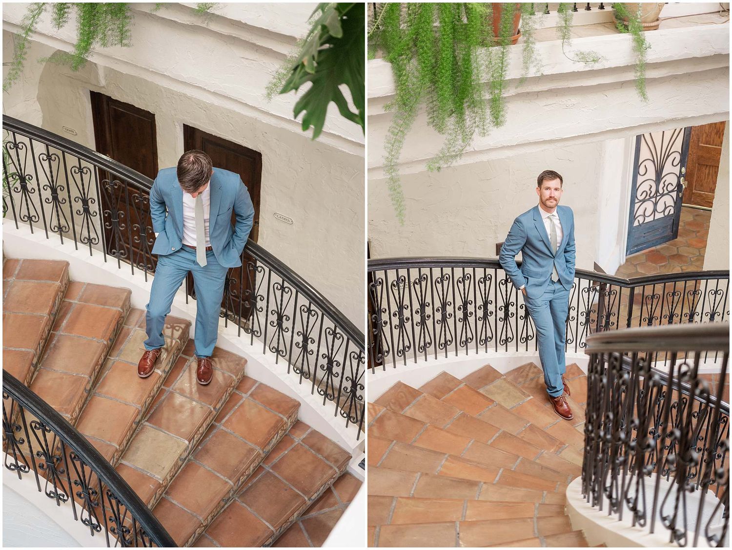 Person in light blue suit walking down ornate terracotta stairs with decorative black iron railing in bright interior.