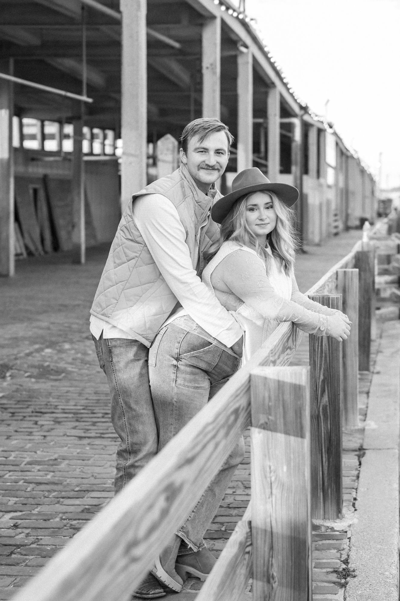 A black and white photo sequence shows a playful interaction between two people leaning against a pillar.