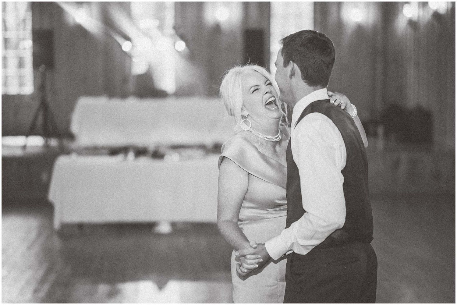 A series of black and white wedding photos showing intimate moments between a couple during their celebration.