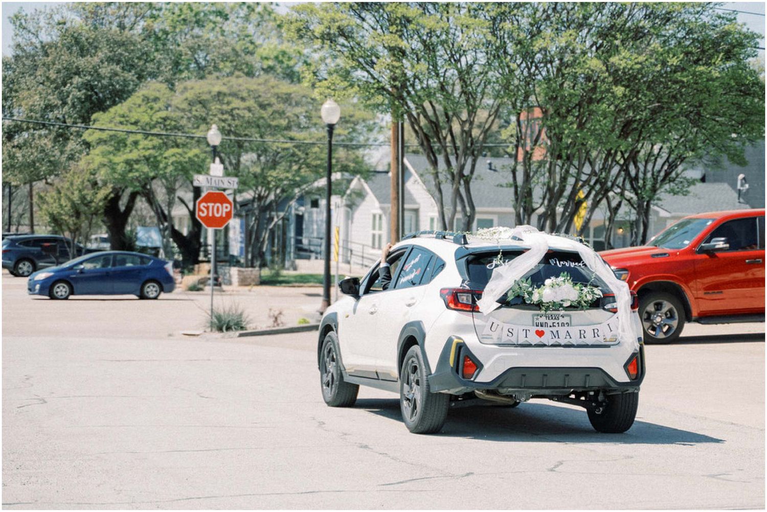 A series of outdoor wedding venue photos showing cars parked along tree-lined paths.