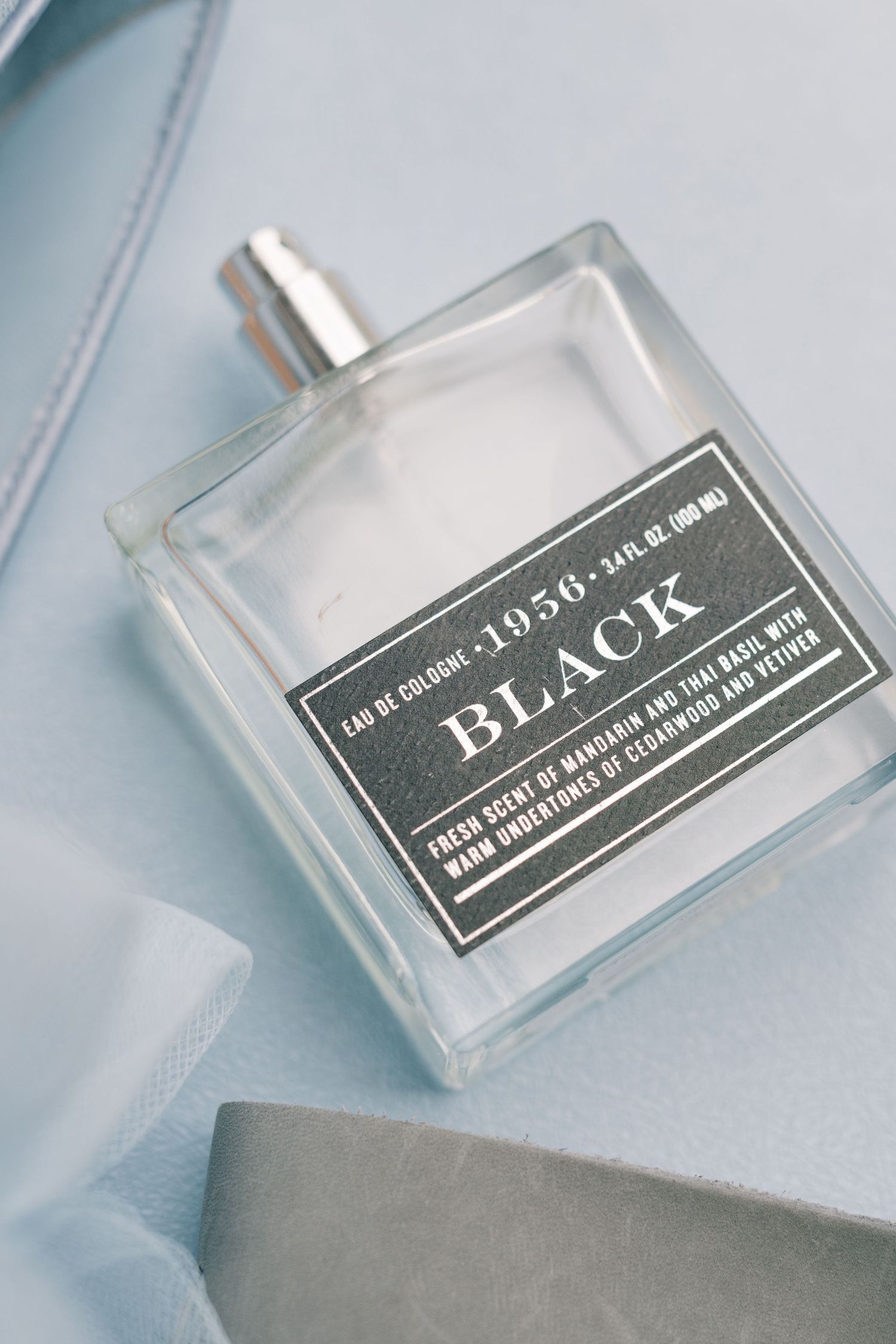 1956 Black Eau de Cologne 3.4 oz bottle with dark label featuring mandarin, basil, cedarwood and vetiver scents.