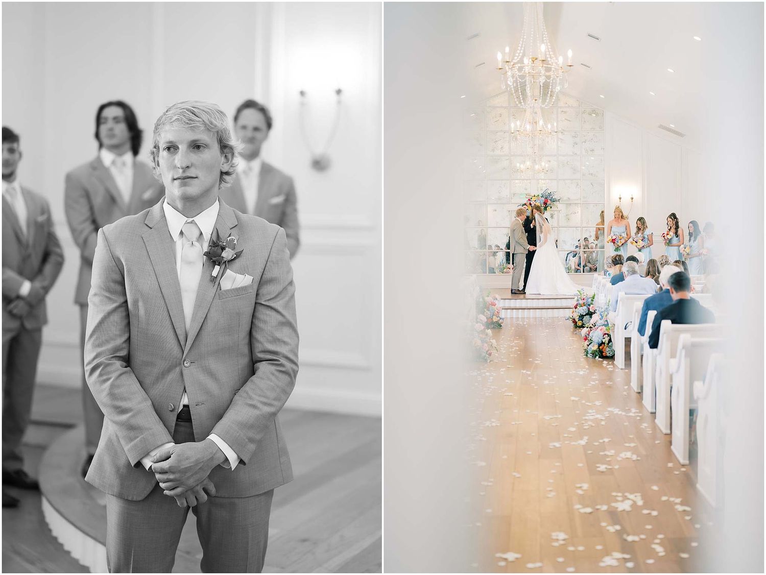 Groom in gray suit awaits bride at altar in elegant white chapel with chandelier and flower-lined aisle.