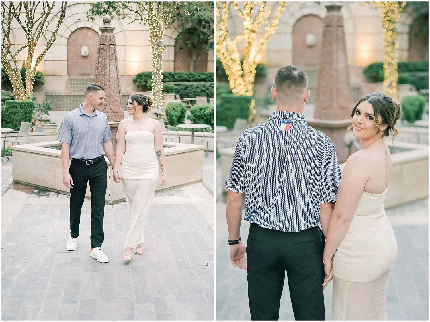 Couple in casual formal attire walking and posing together in an outdoor courtyard with stone architecture.