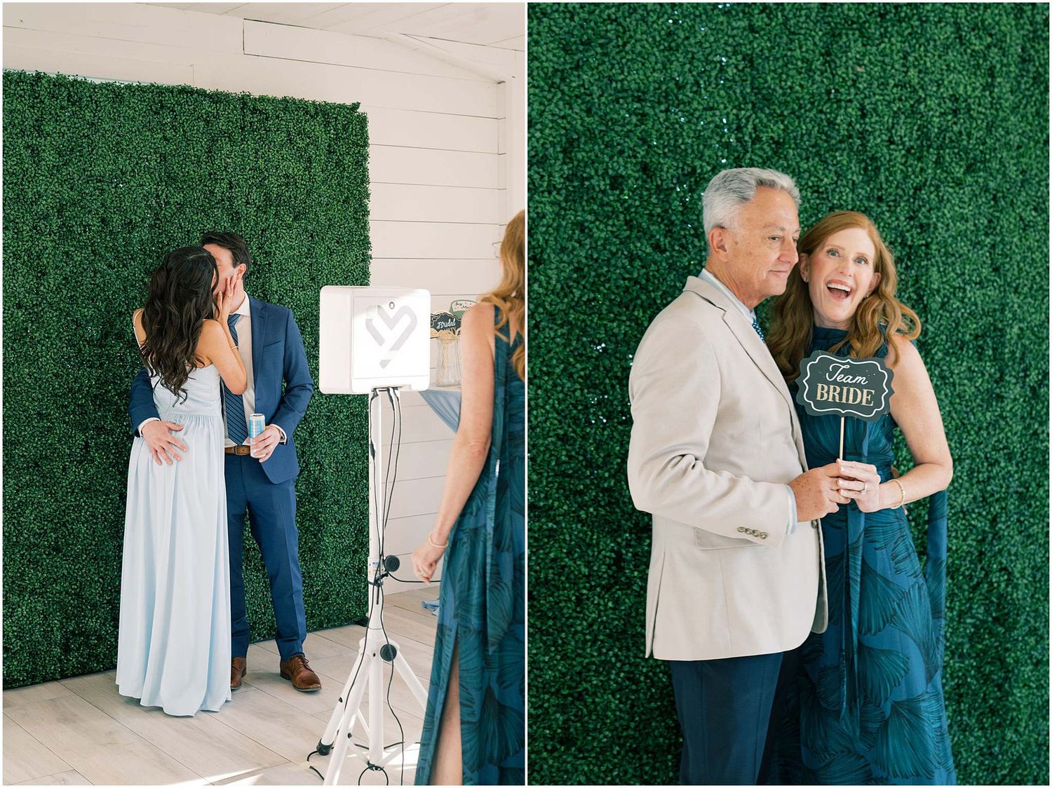 Couples posing and laughing in front of a lush green hedge wall photo booth backdrop at a wedding event.