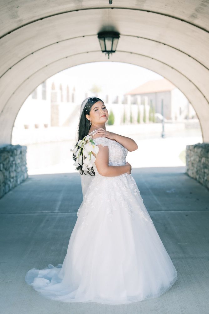 A flowing white wedding dress twirls elegantly under a stone archway in an artistic bridal photo sequence.
