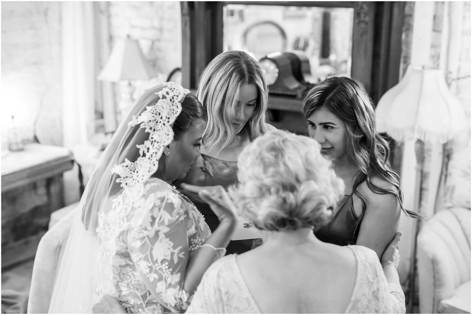 Elegant wedding ceremony moments captured in a rustic venue with exposed brick walls and romantic lighting.
