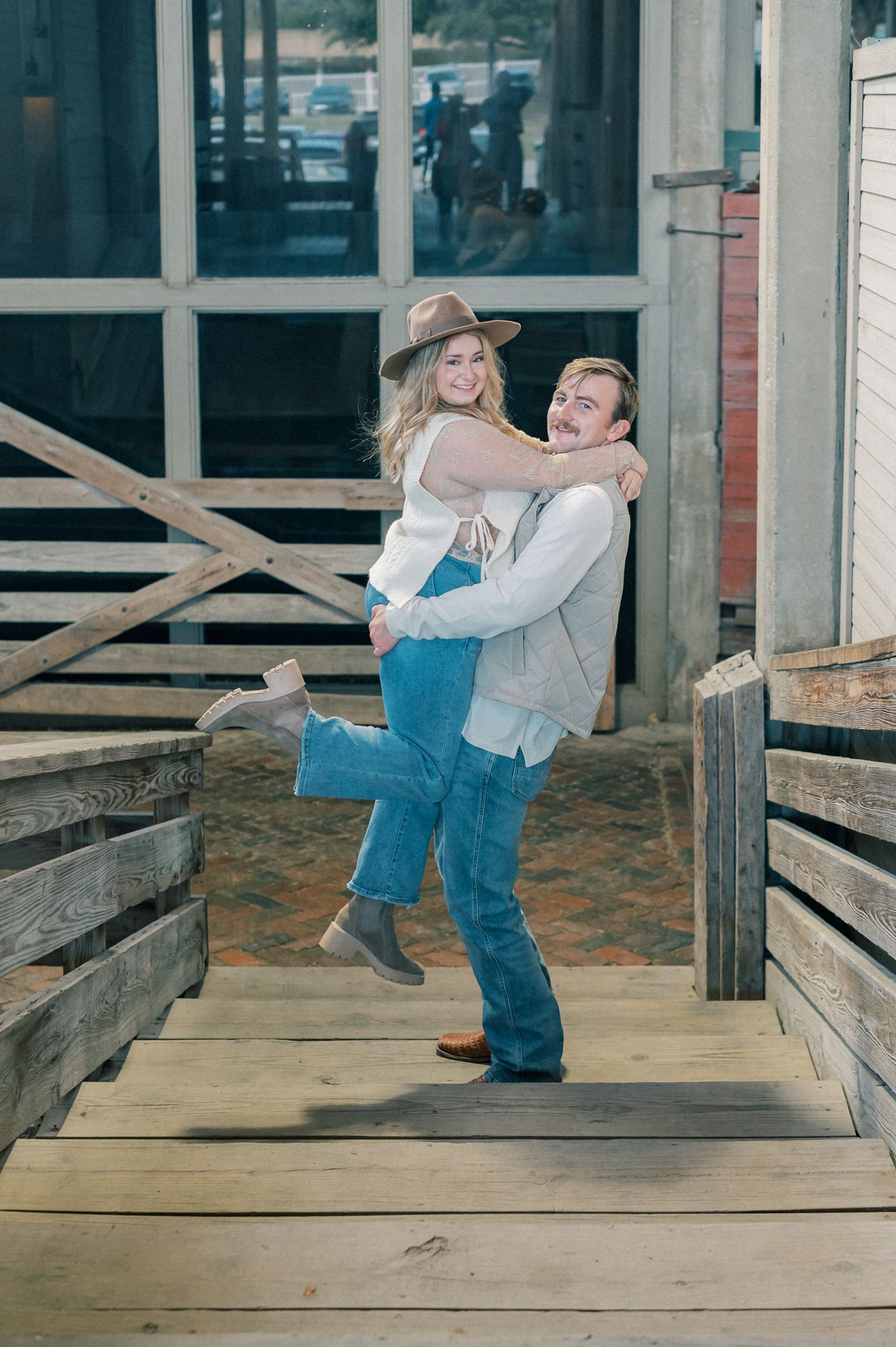 A playful sequence of dance-like poses captured on a wooden deck with rustic architectural elements.