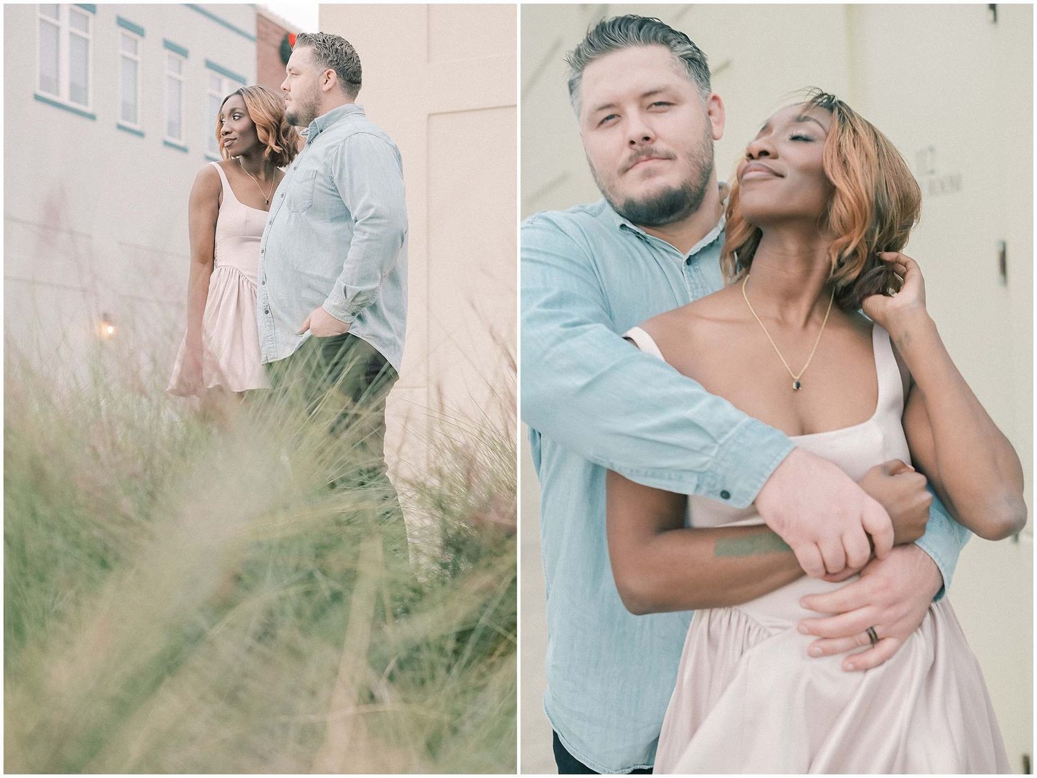 Couple in casual attire sharing tender moment against light colored wall.