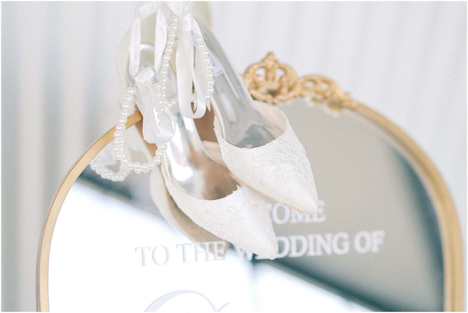 Wedding invitation text and decor elements in elegant cream and white tones.