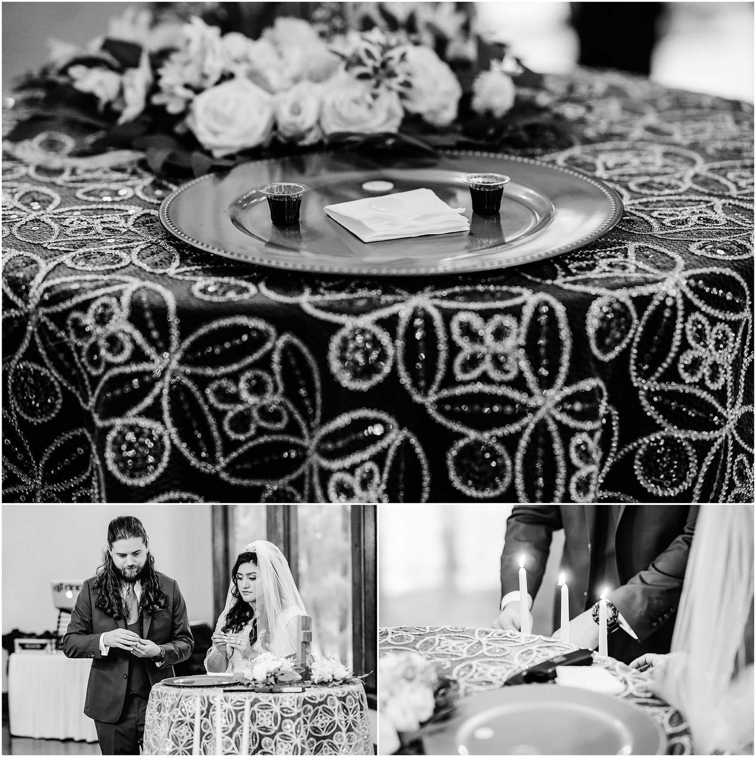 Black and white wedding reception table with ornate lace tablecloth, floral centerpiece, and couple signing documents by candlelight.