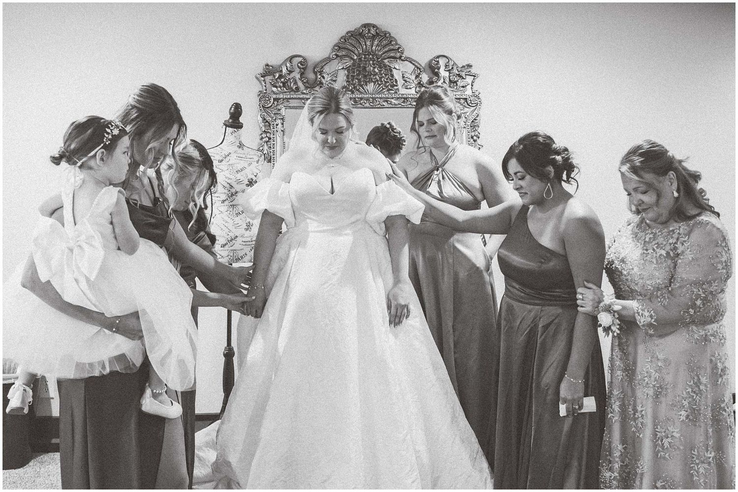 Classic black and white photographs show wedding day preparations with bridal party members.