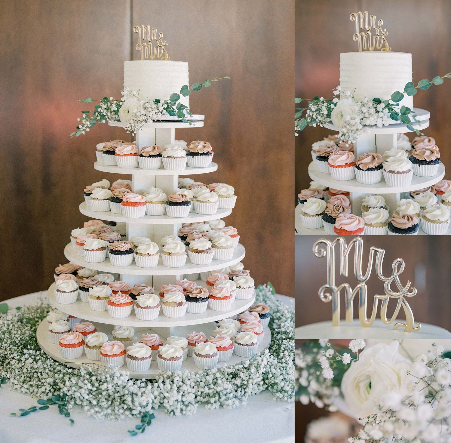 Wedding dessert display featuring white tiered cake and cupcakes adorned with baby's breath flowers.