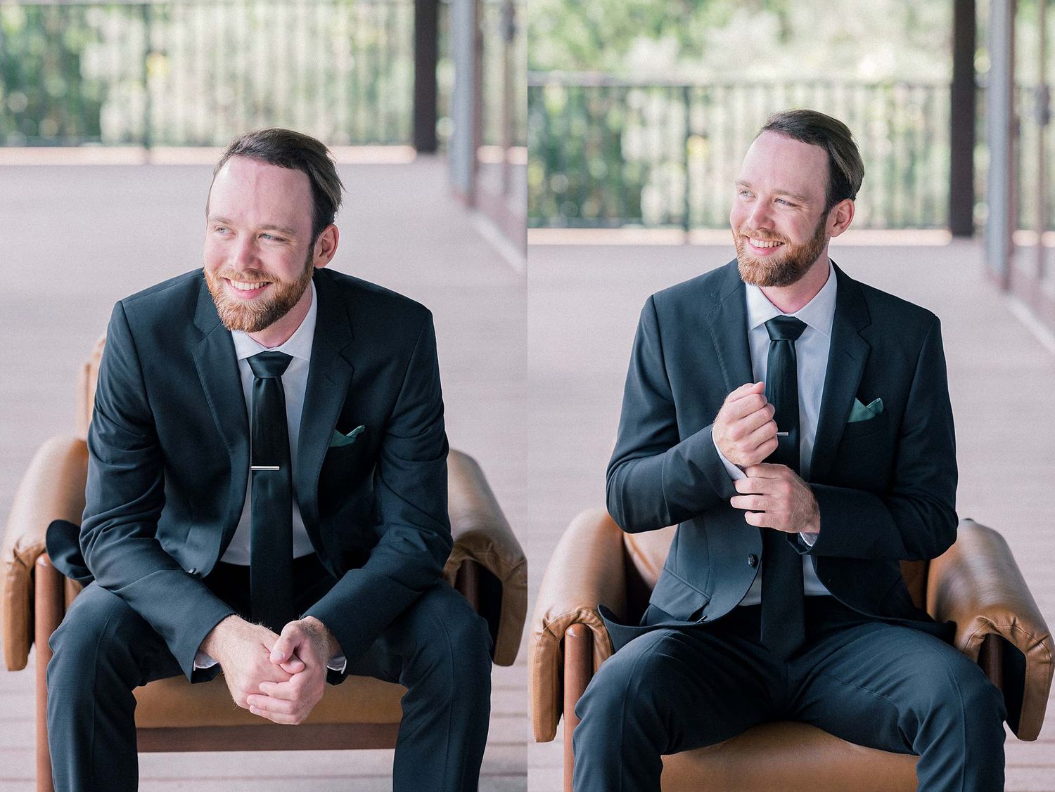 Groom sitting in leather chair wearing dark suit during wedding preparations.
