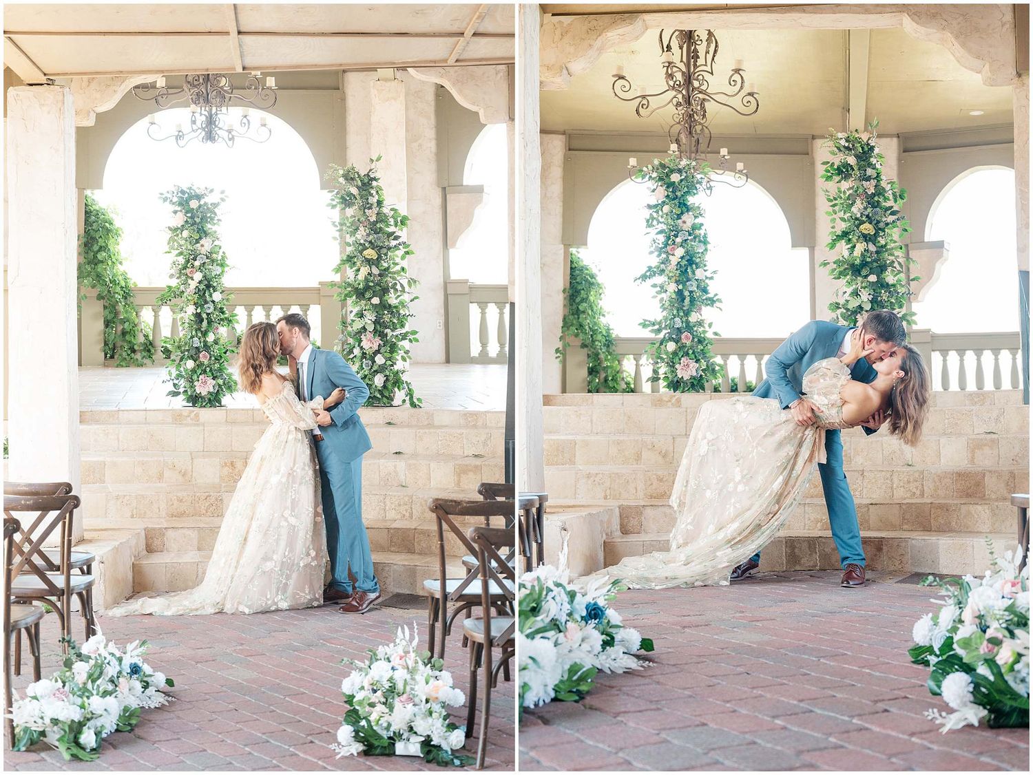 Wedding venue with stone archways decorated with white floral arrangements and greenery.