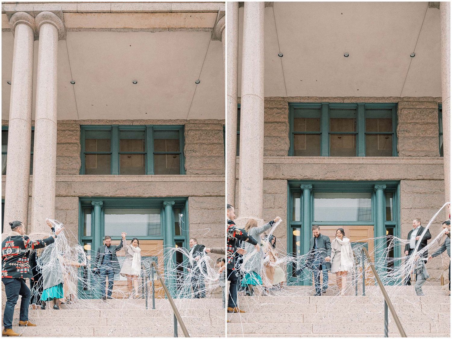 Wedding party gathers on grand building steps with white columns and turquoise doors for outdoor ceremony photos.