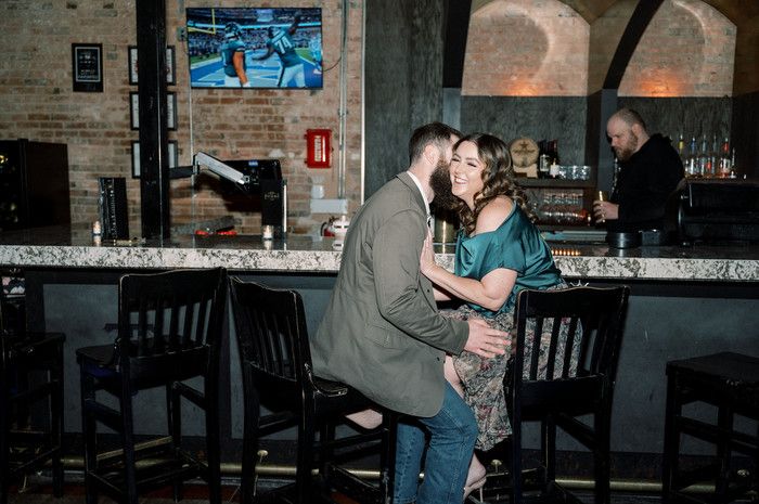 Dancing sequence in a cozy restaurant setting with brick walls and ambient lighting.