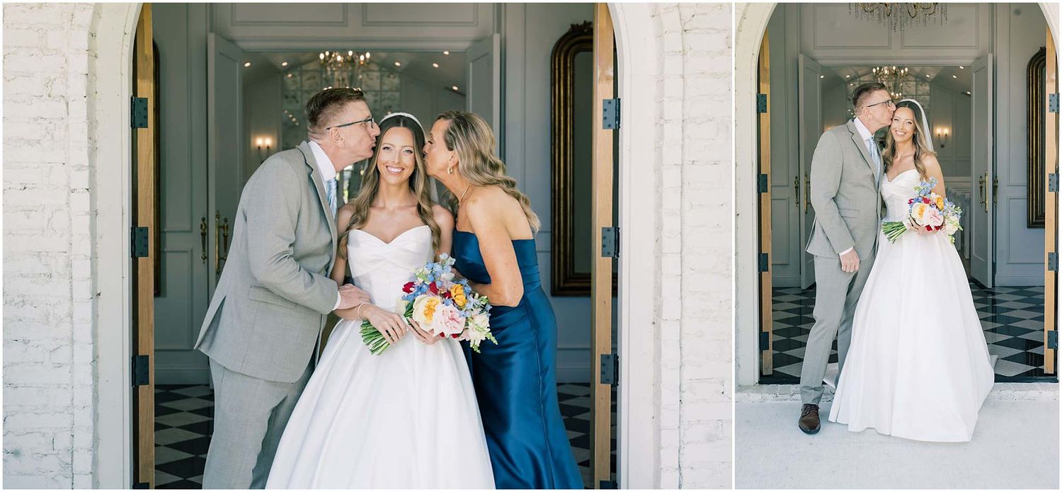 Bride and groom share a romantic moment with bridesmaid in navy dress at elegant white brick venue.