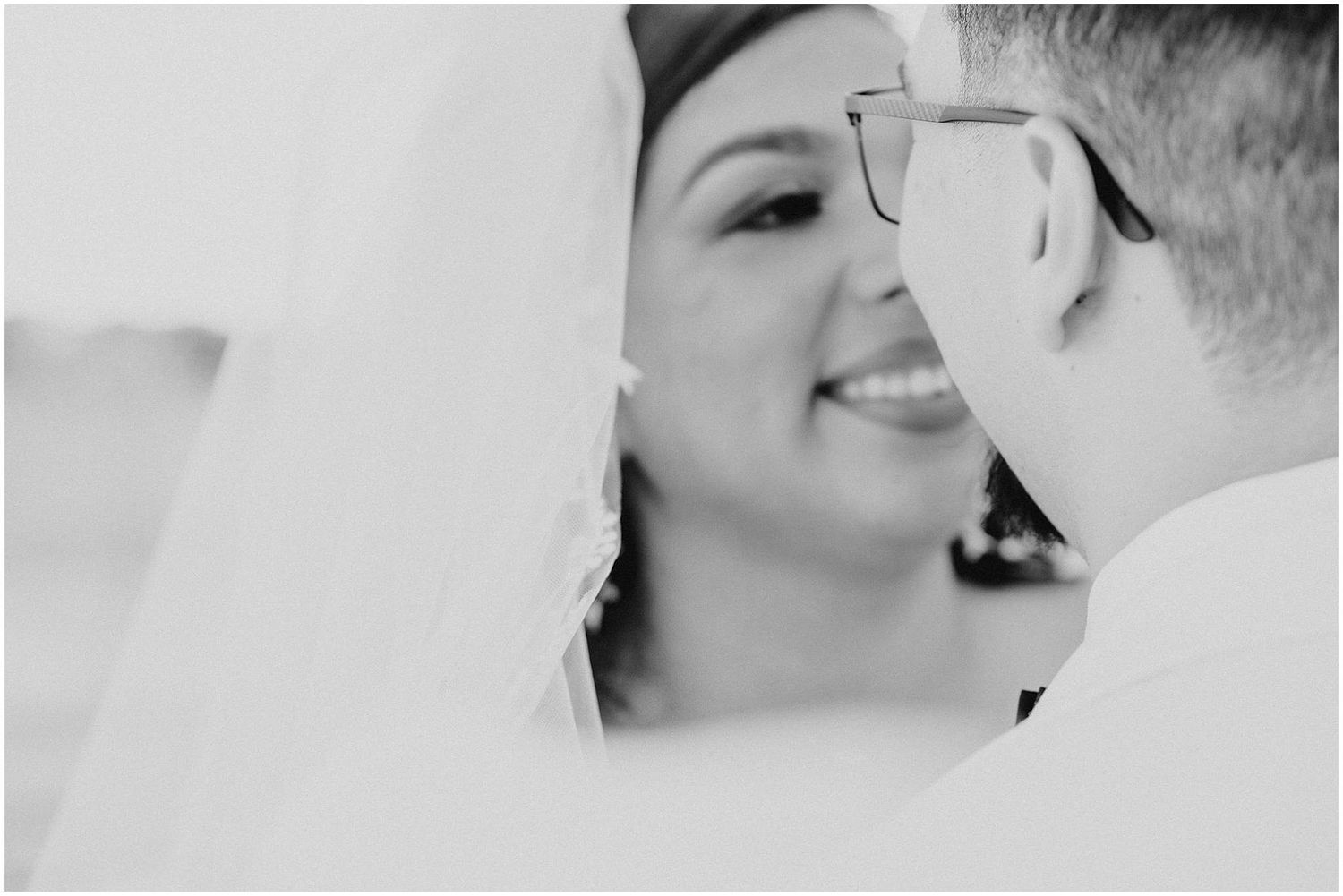 Black and white close-up shots of tender wedding ceremony moments.