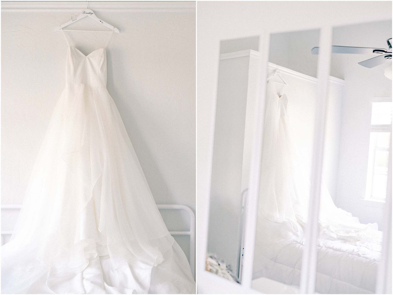 White wedding dress hanging in a bright, minimalist room with natural light.