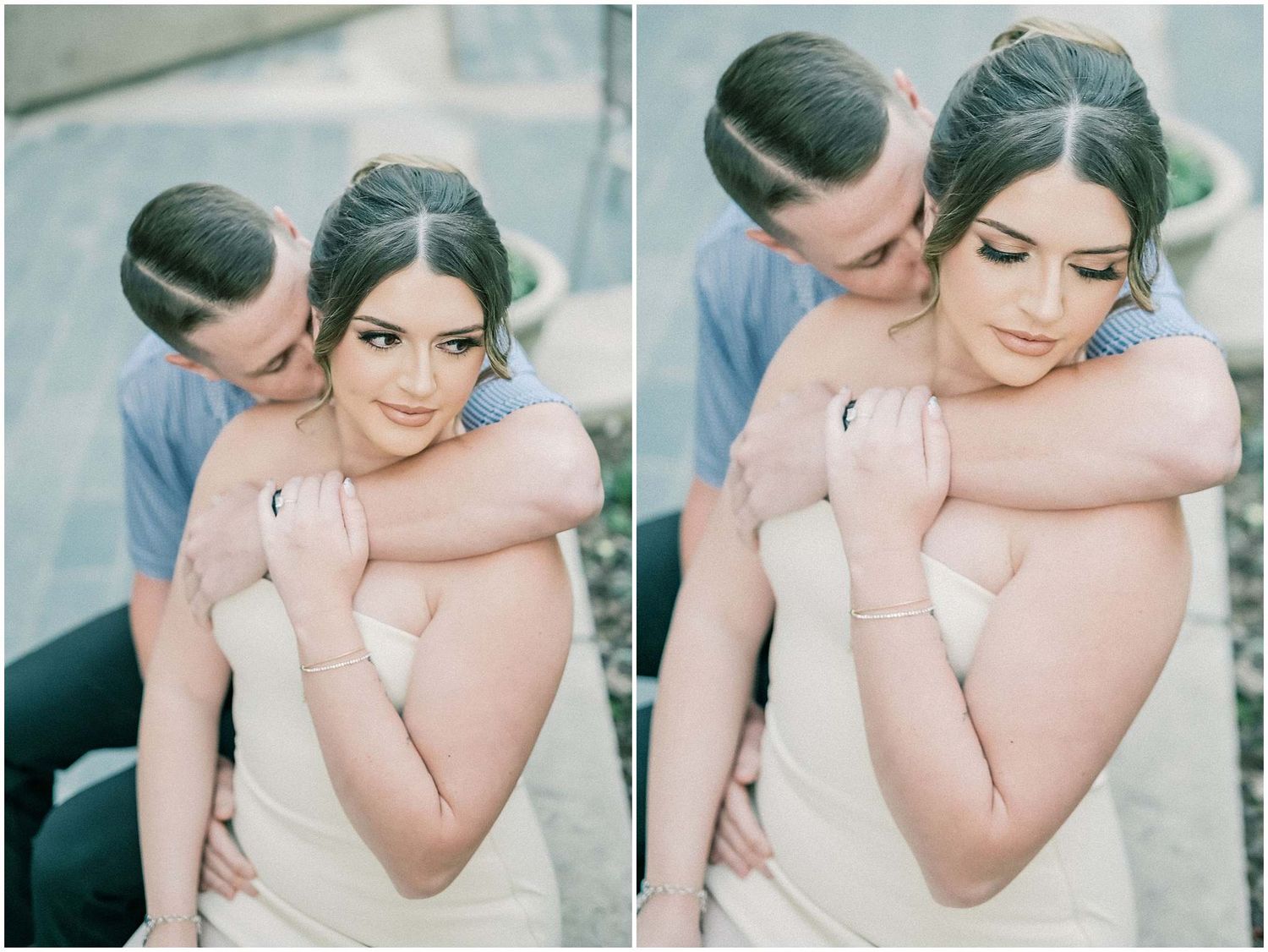 Romantic couple embraces in soft pastel tones during an intimate outdoor portrait session.