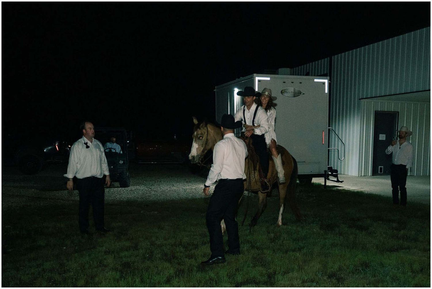 Nighttime exterior view of a wedding venue with dim lighting.