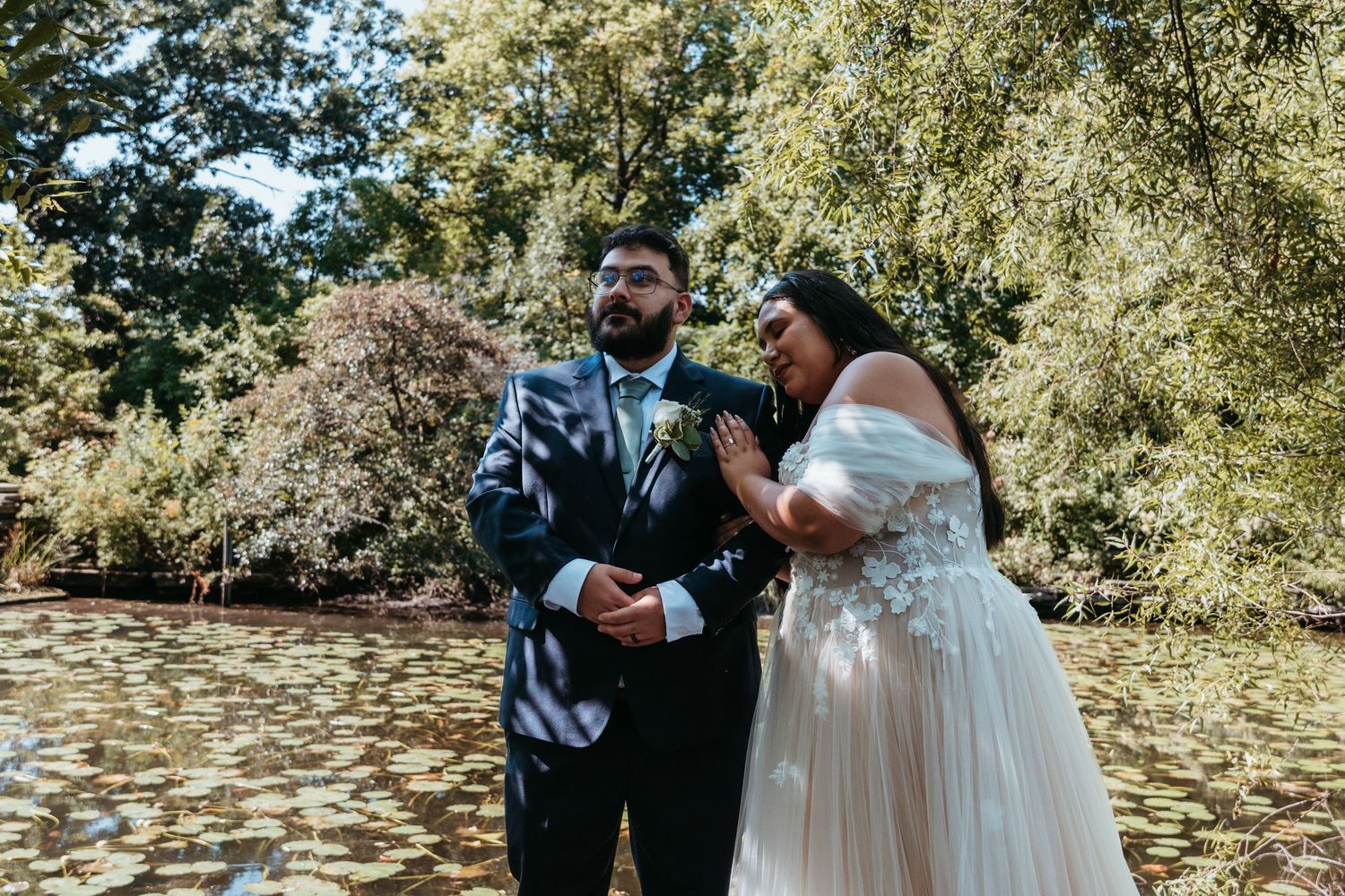 A wedding couple at Alfred Caldwell Lily Pool in Chicago, Illinois