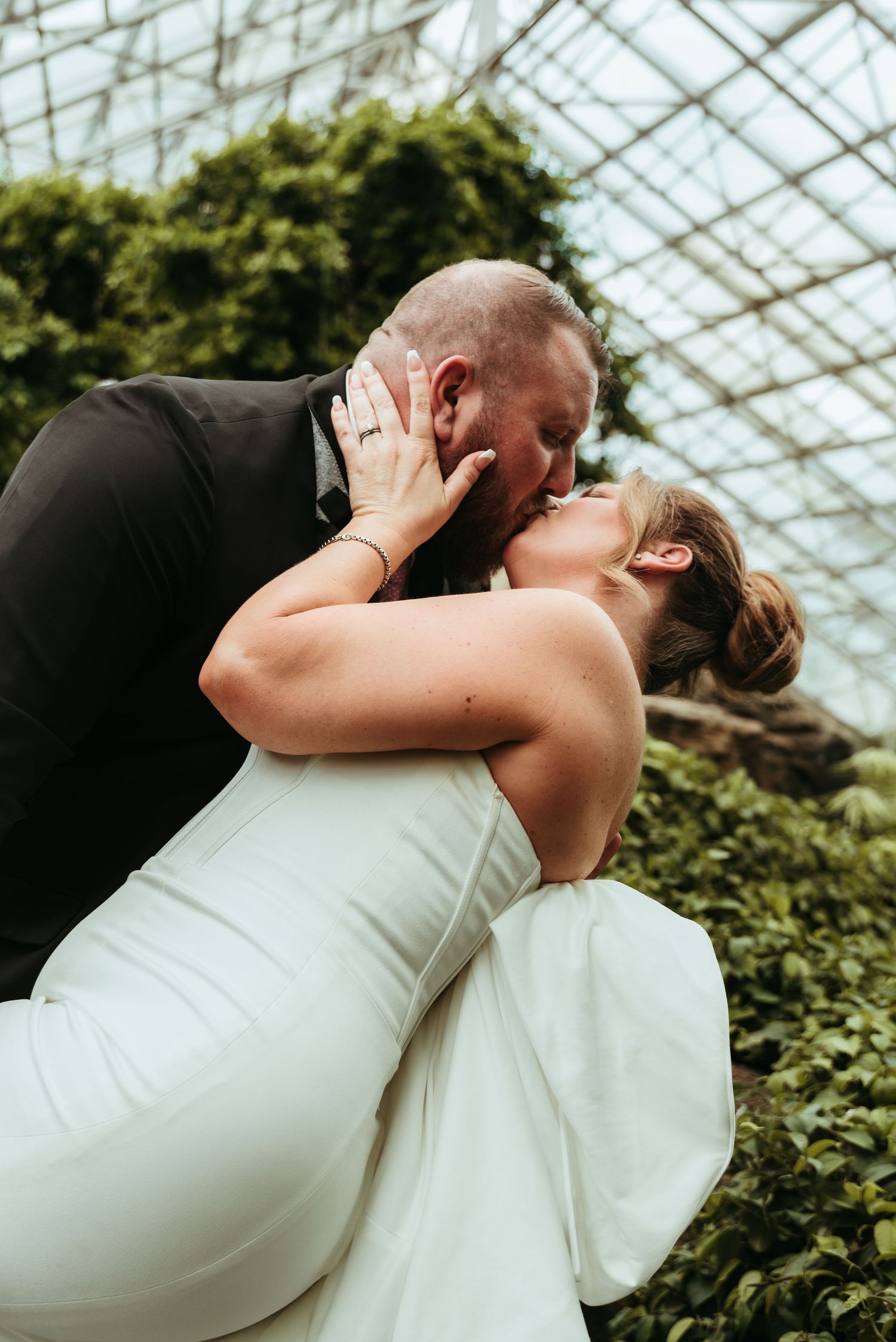 A couple after their wedding at Foellinger-Freimann Botanical Conservatory in Fort Wayne, Indiana