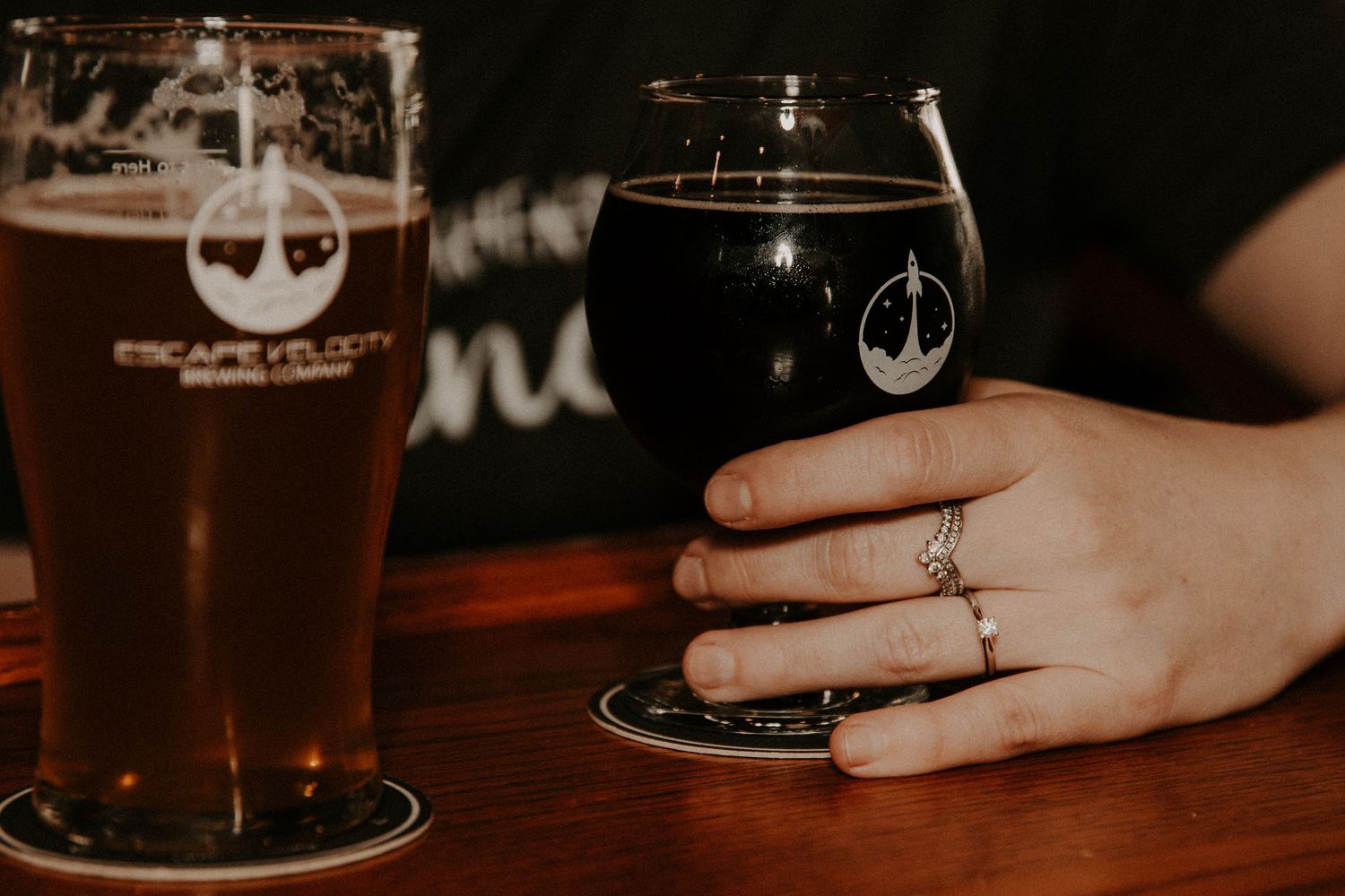 An engagement photo at Escape Velocity Brewery in Lafayette, Indiana