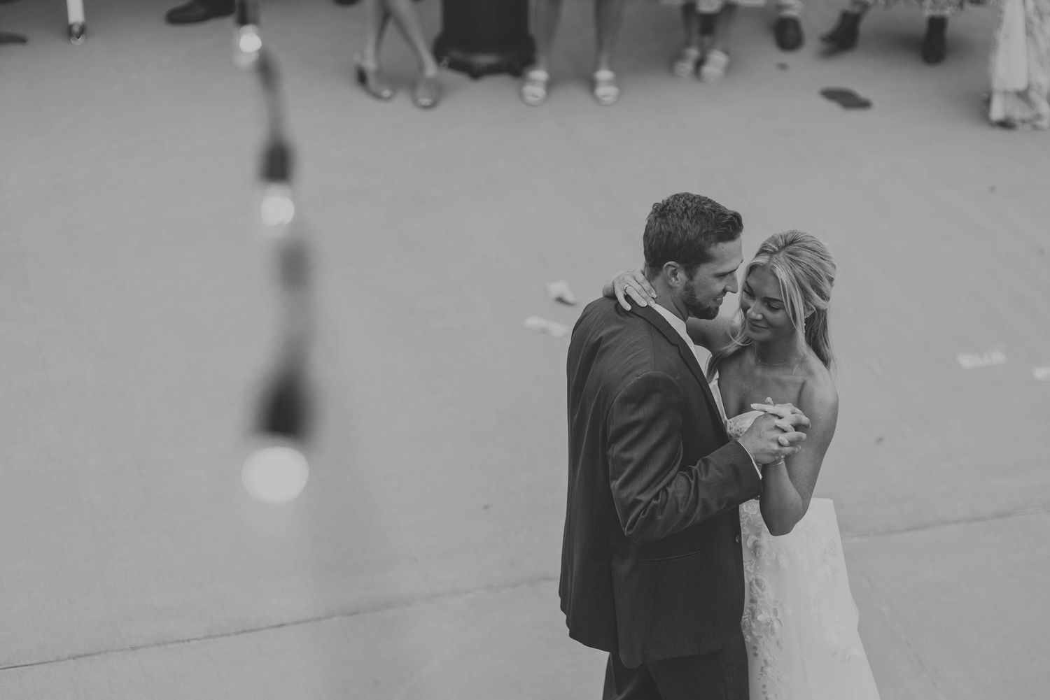 Emotional moments during a wedding ceremony captured in a series of black and white photographs.