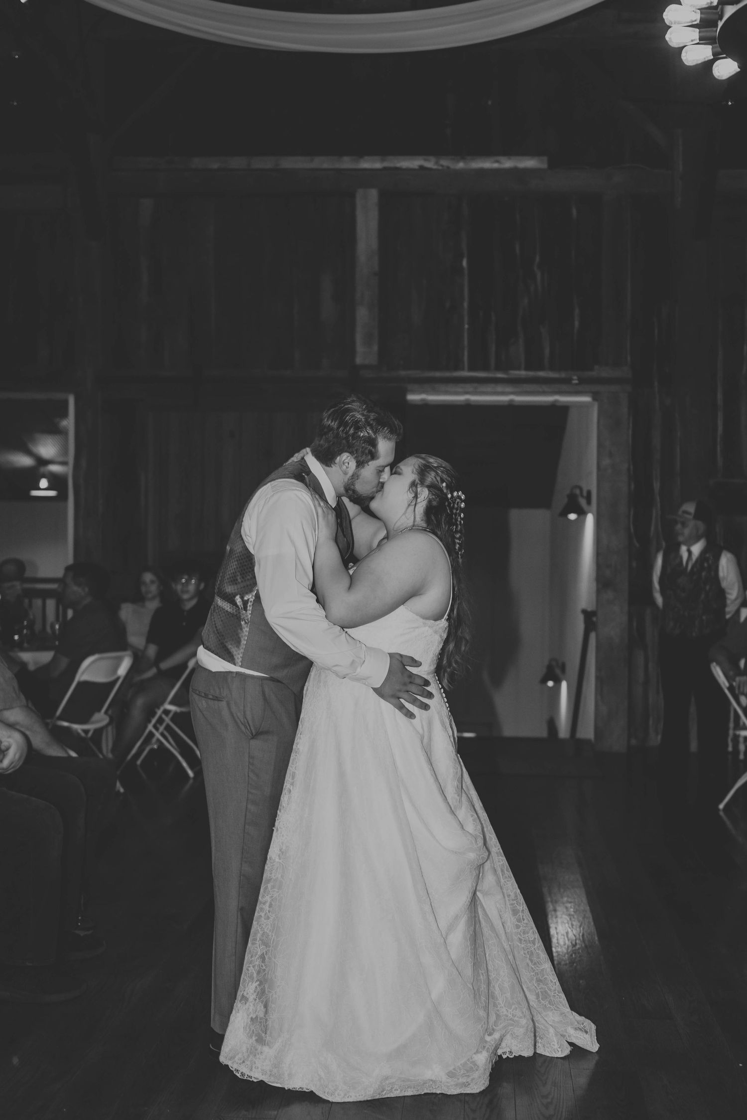 Wedding reception dance captured in black and white photography.