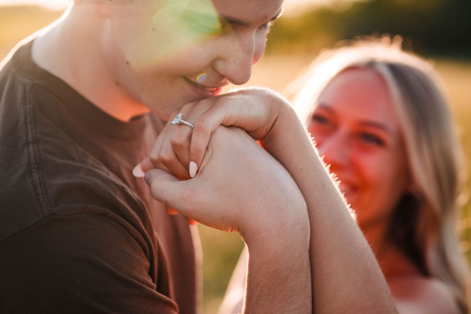 Romantic couple sharing intimate moment at golden hour on the beach.