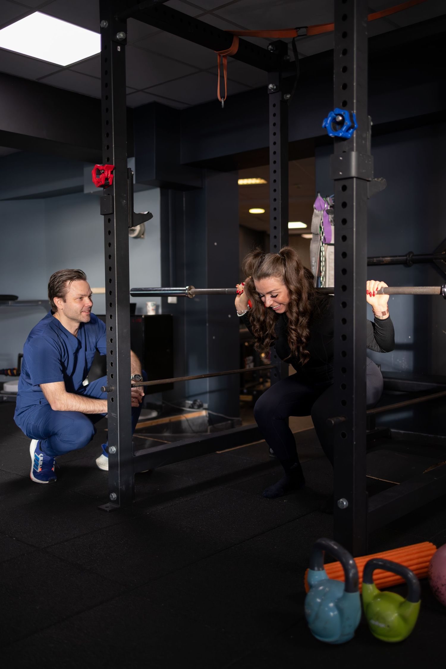 squat with personal trainer