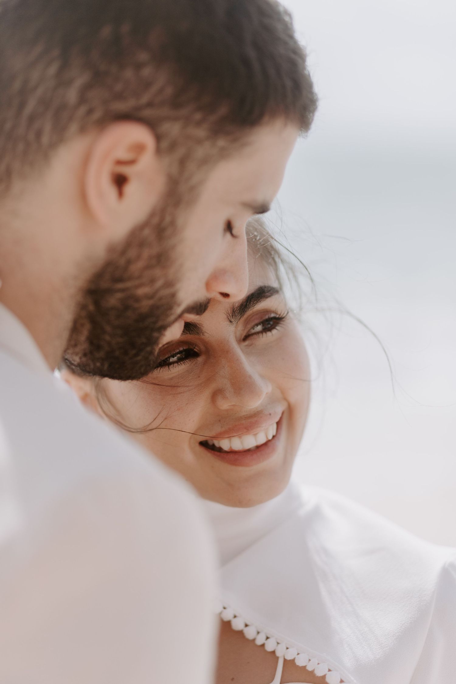 Intimate close-up portrait capturing a tender moment in natural light.