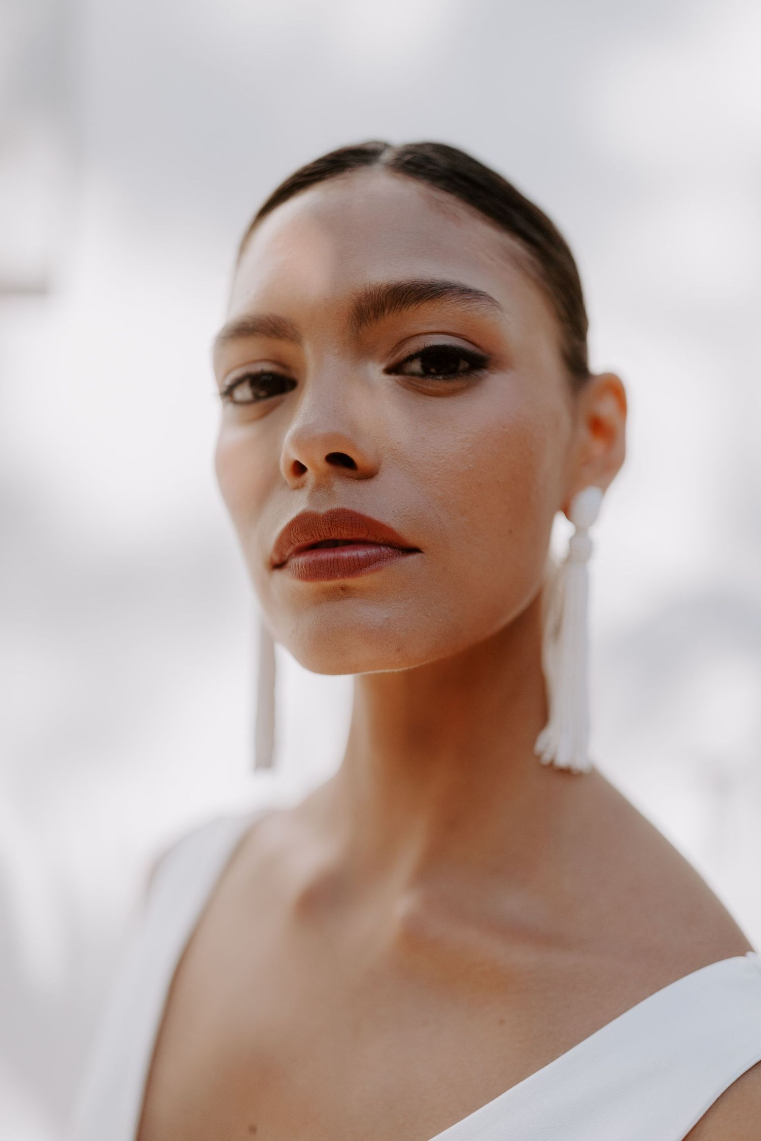 Elegant beauty portrait showcasing classic makeup and sophisticated styling on bride.