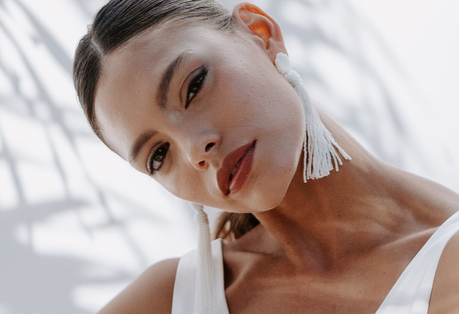 Close-up beauty portrait with dramatic lighting and shadow effects of bride