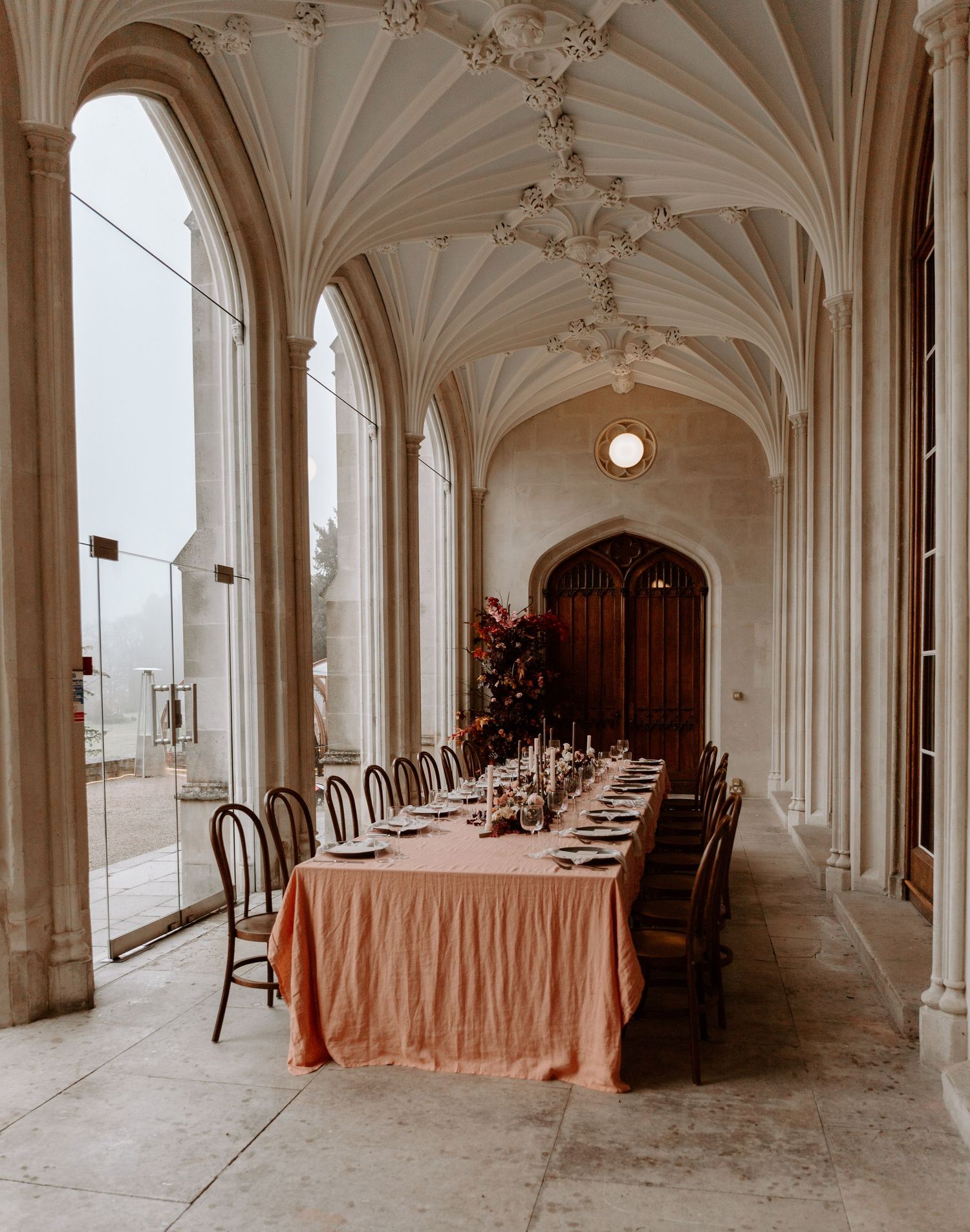 Gothic cathedral interior with vaulted ceilings and elegant table settings for wedding