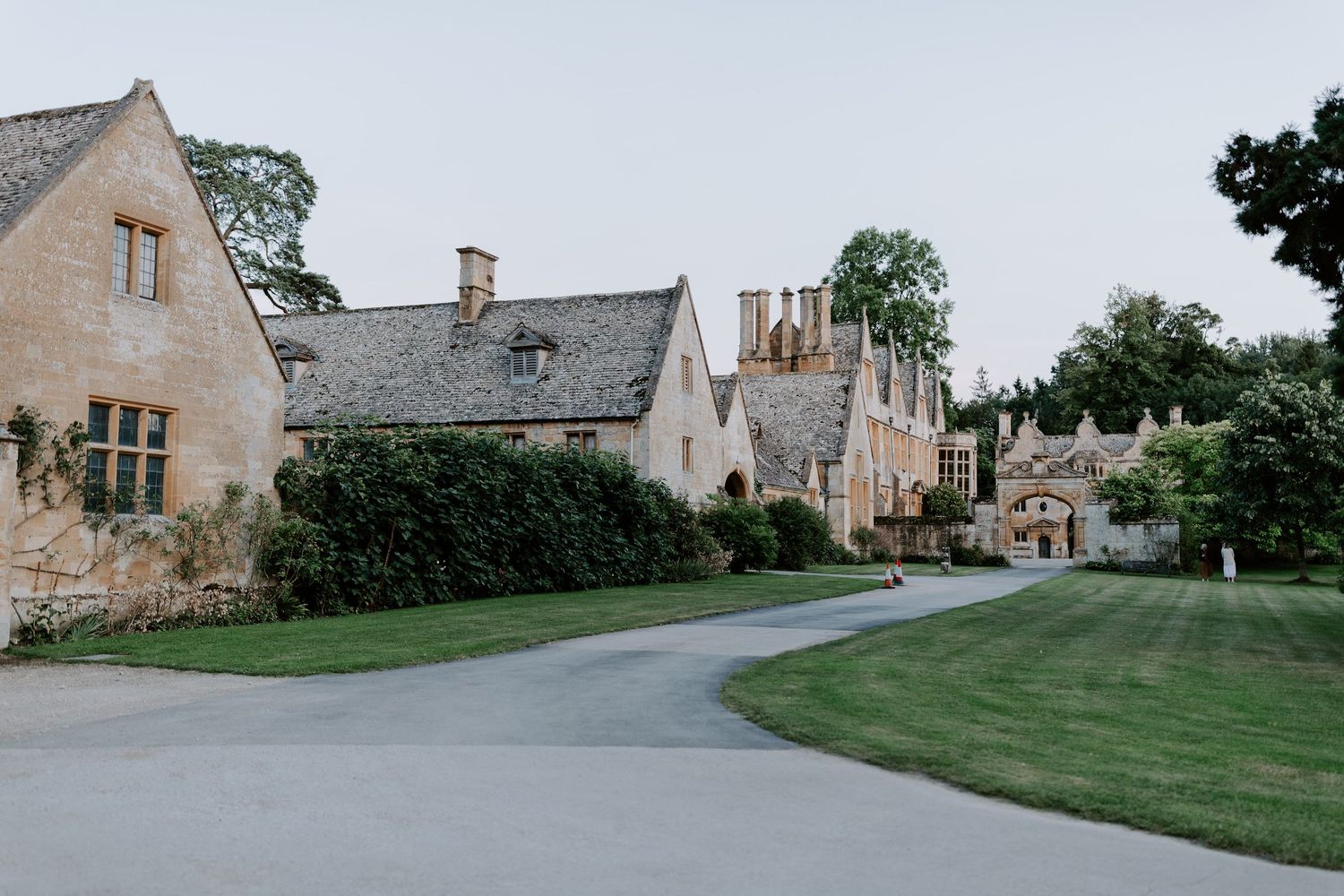 Cotswolds wedding building and pathways of a historic countryside venue.