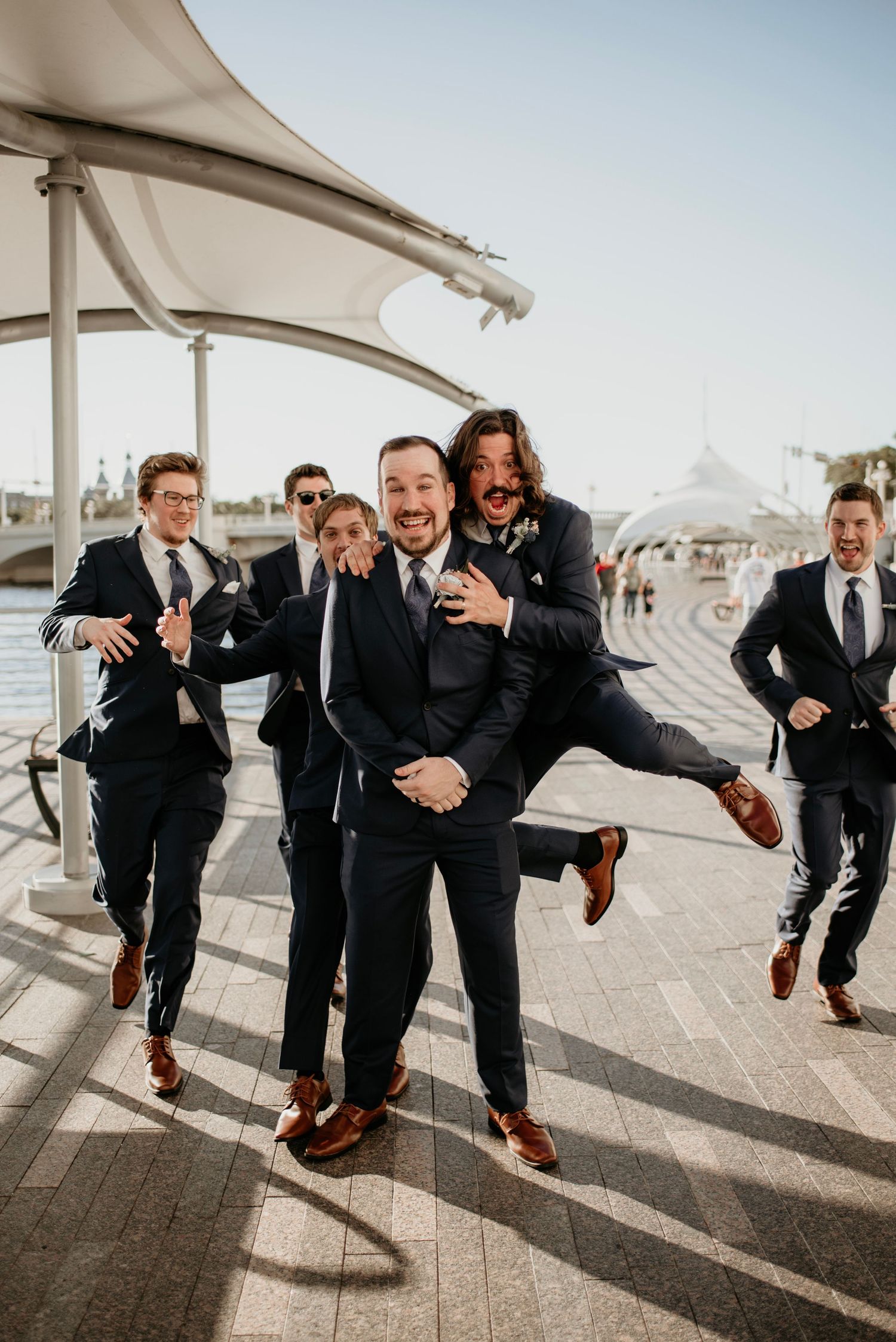 Groomsmen Tampa River Walk wedding Captured by Willow + Vine Photography