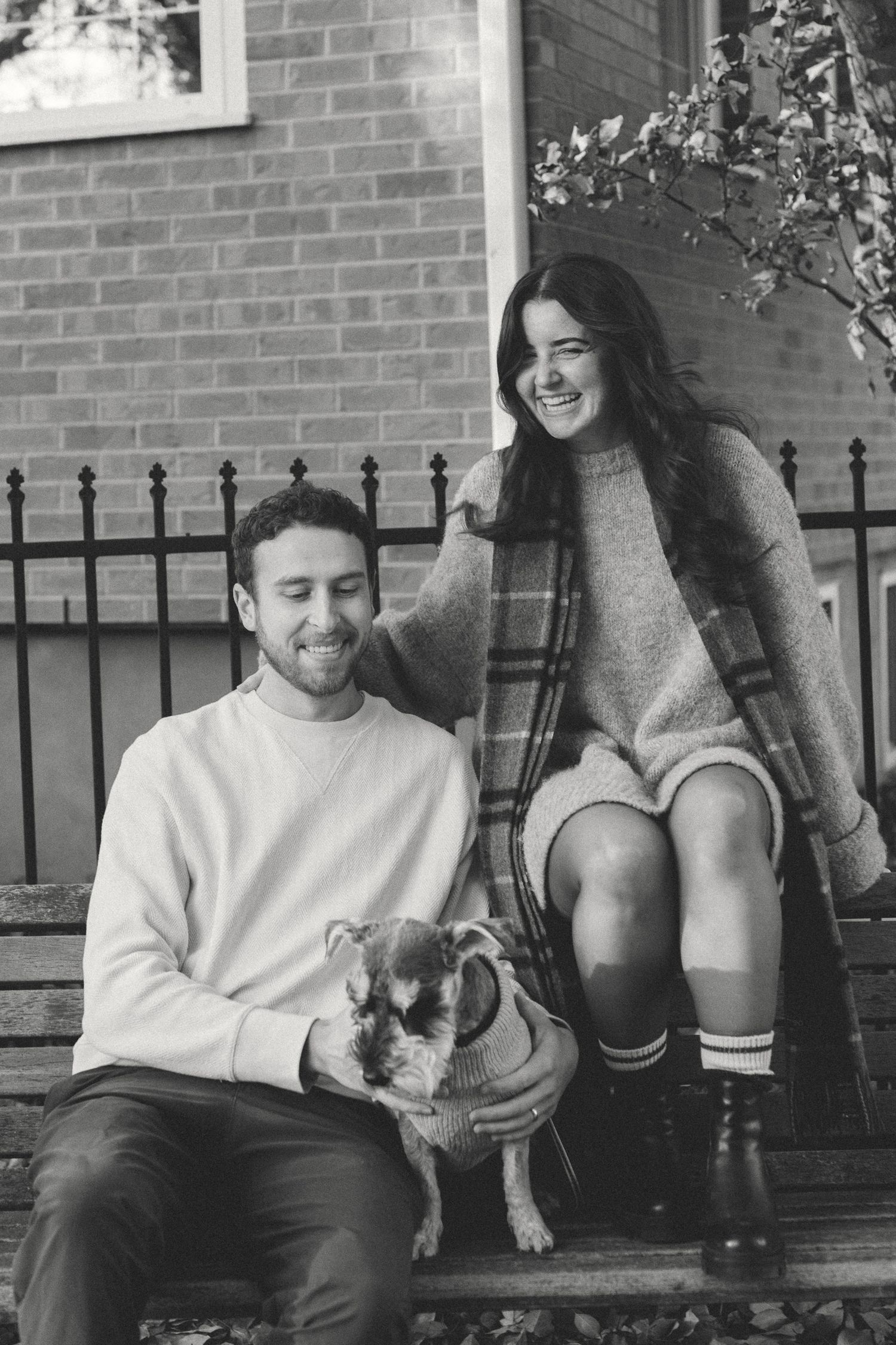 A couple sits together on a bench with a small dog, shown in a series of black and white photographs.