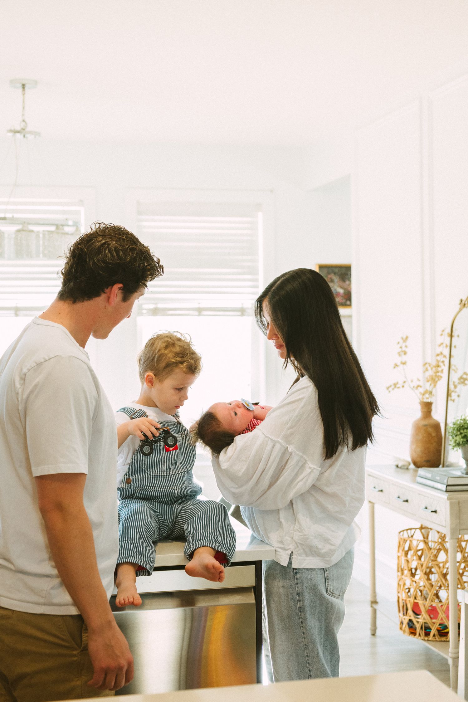 A series of candid photos showing people interacting in a bright kitchen setting.