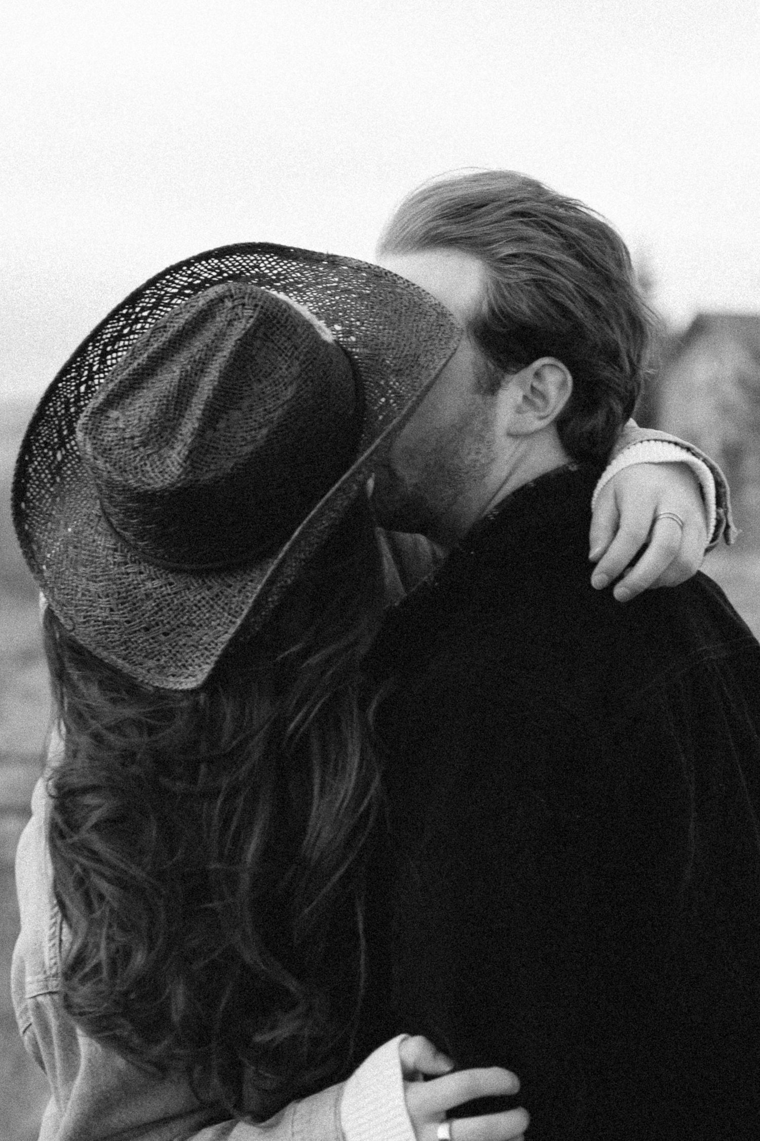 Intimate black and white photo sequence showing tender moments between a couple.