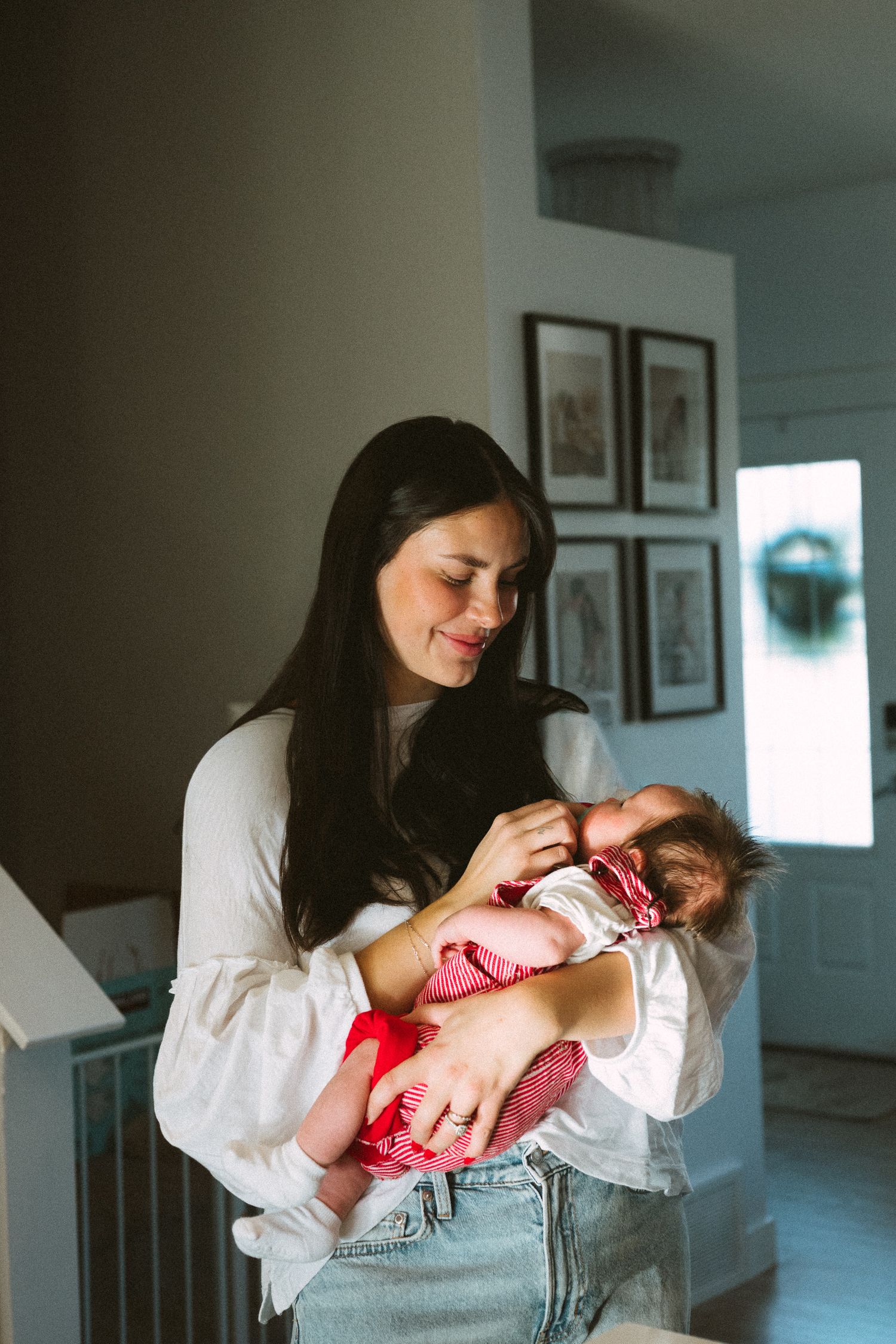 A series of tender moments showing a baby being cradled and nurtured in a bright home setting.