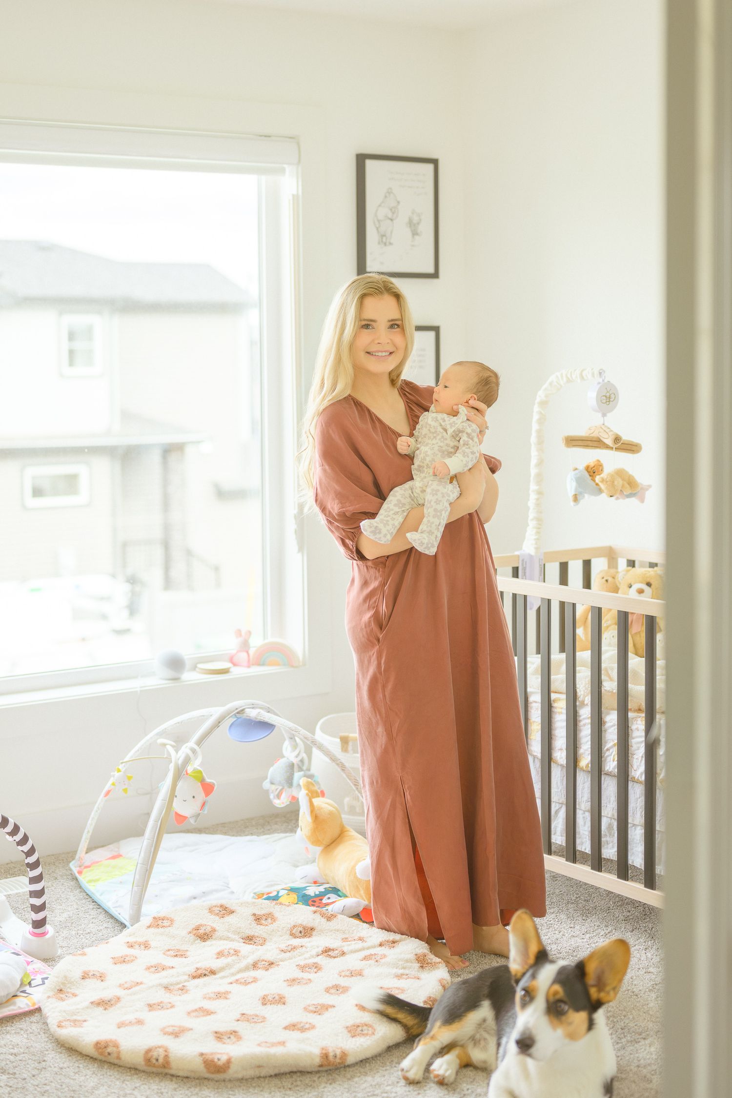Bright nursery room with colorful play mat and wooden crib.